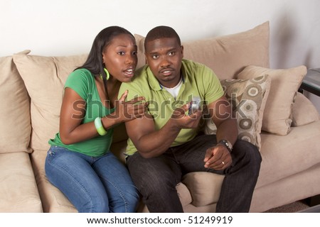 https://ducthanhco.vn/wp-content/uploads/2023/02/stock-photo-young-african-american-couple-sitting-in-living-room-on-couch-watching-tv-together-51249919.jpg